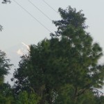 Viharin.com- Mountain peak from between the trees