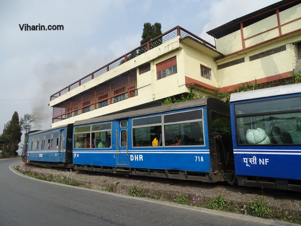 Viharin.com- Train passing by houses